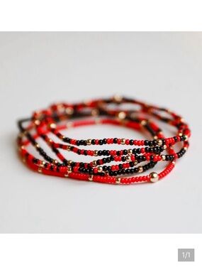 6 Layered Red and Black Beaded Bracelets with Gold accent Beads.